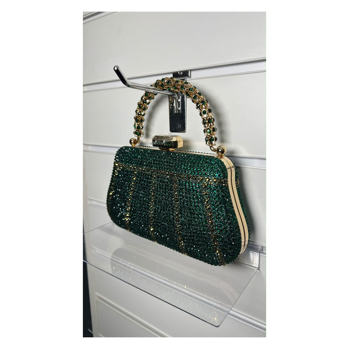 The Crystal Royale rhinestone evening clutch bag in emerald green with gold-tone handle